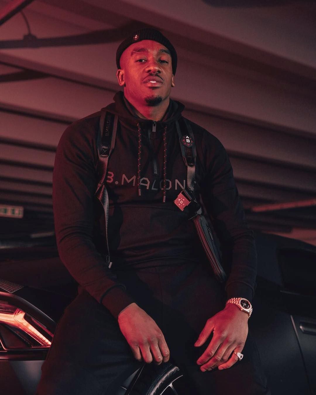 Who is Bugzy Malone and what's the rapper's real name?