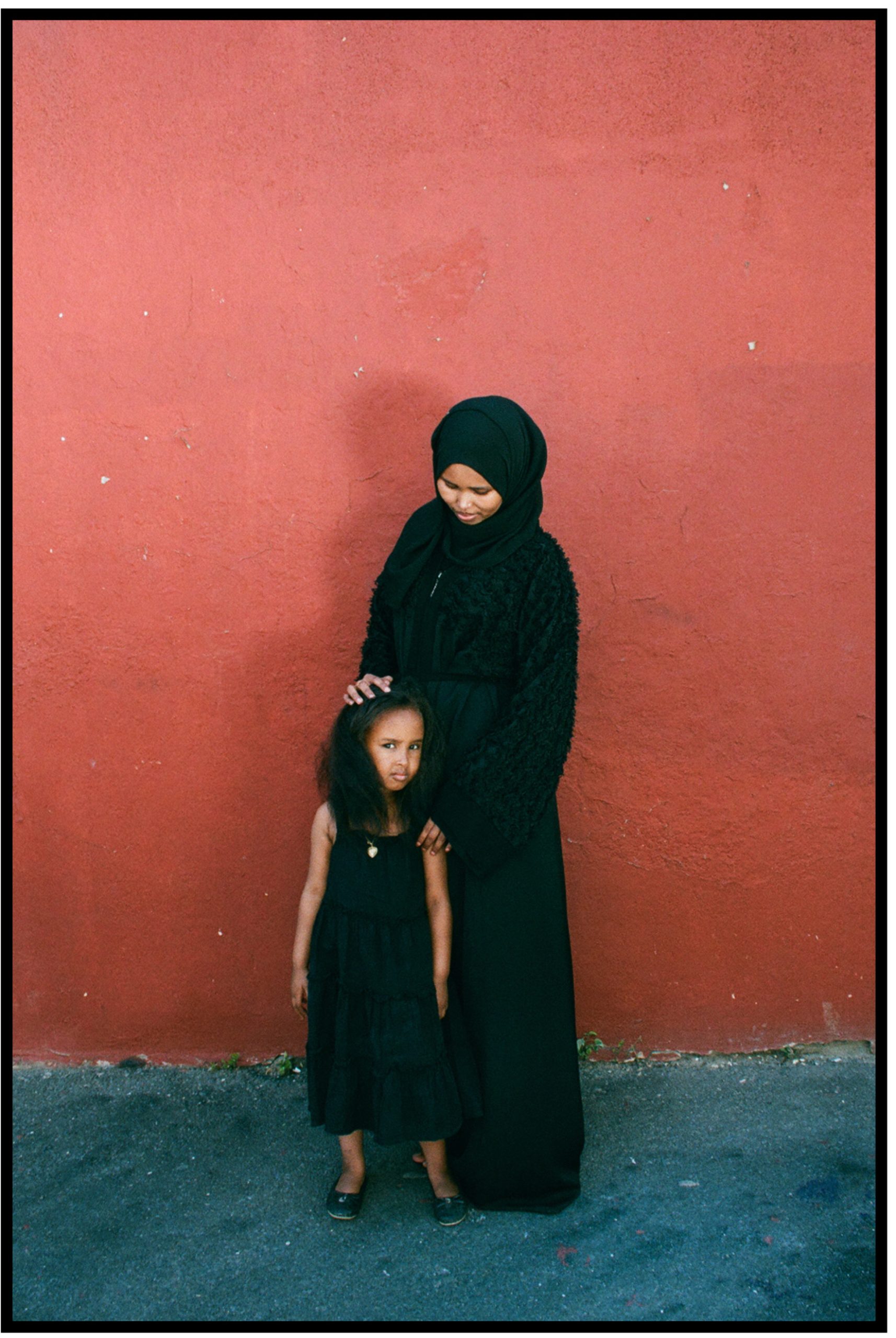Heaven Lies At Thy Mothers Feet bu Faatimah Allie and Ya’eesh Dollie 7_Hijabi mother in black with young daughter in black with kinky long hair