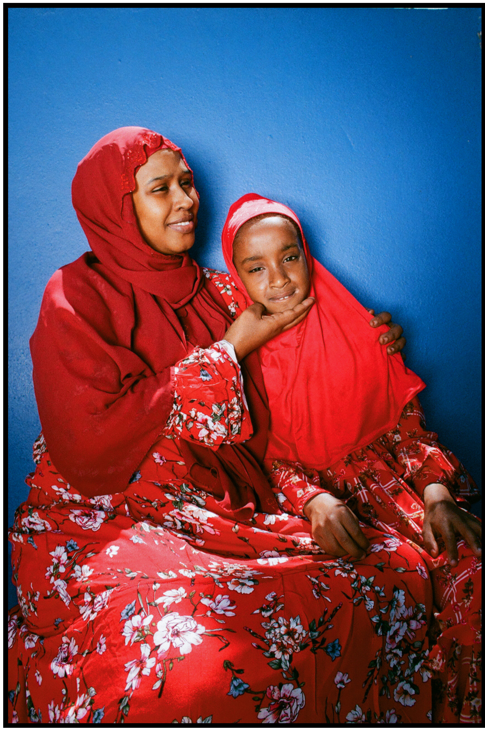 Heaven Lies At Thy Mothers Feet bu Faatimah Allie and Ya’eesh Dollie_Hijabi Mother and Daughter in Red